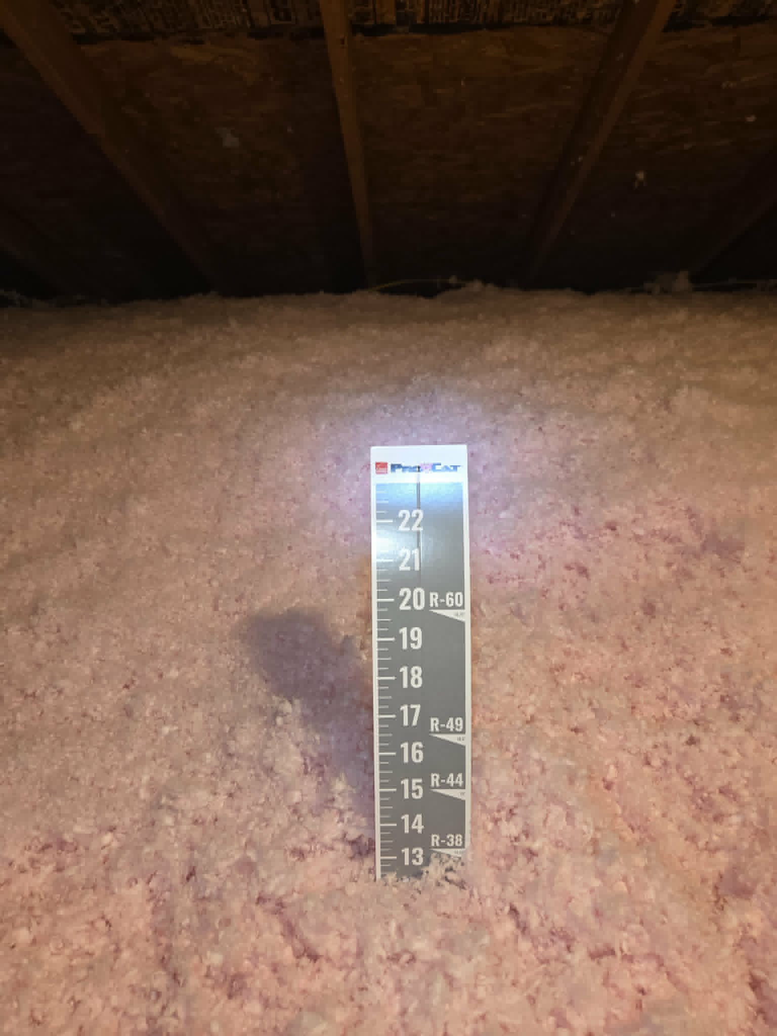 Attic blown-in insulation depth check